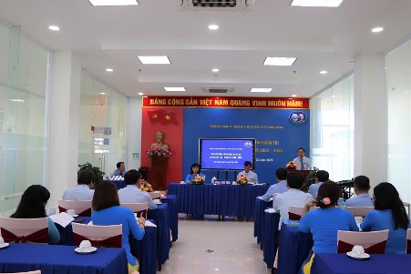 A group of people sitting at a table in a roomDescription automatically generated